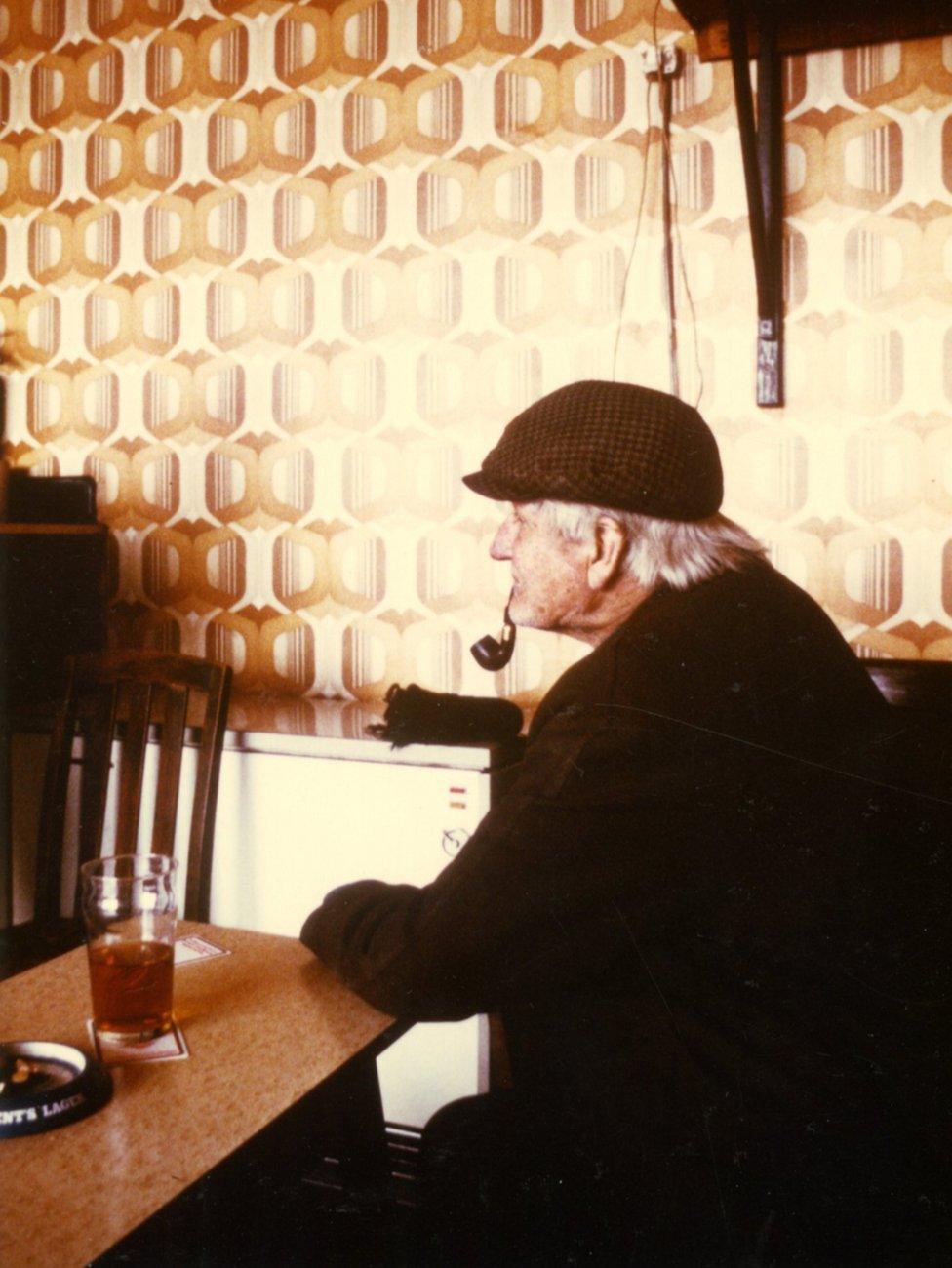 A drinker in an unnamed Middlesbrough pub, smoking a pipe