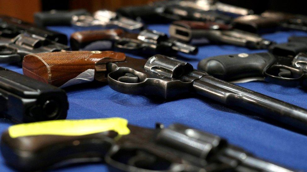 A file photograph showing guns on display at a press conference announcing the bust of a gun trafficking ring at Police Headquarters in New York, New York, USA, 27 October 2015