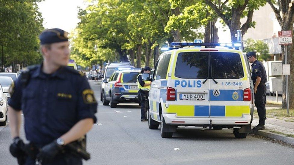 Police at the scene of a shooting in Stockholm