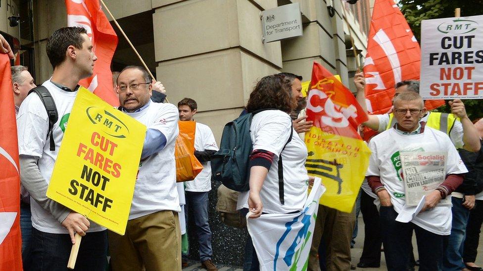 Members of the RMT demonstrate outside the Department for Transport