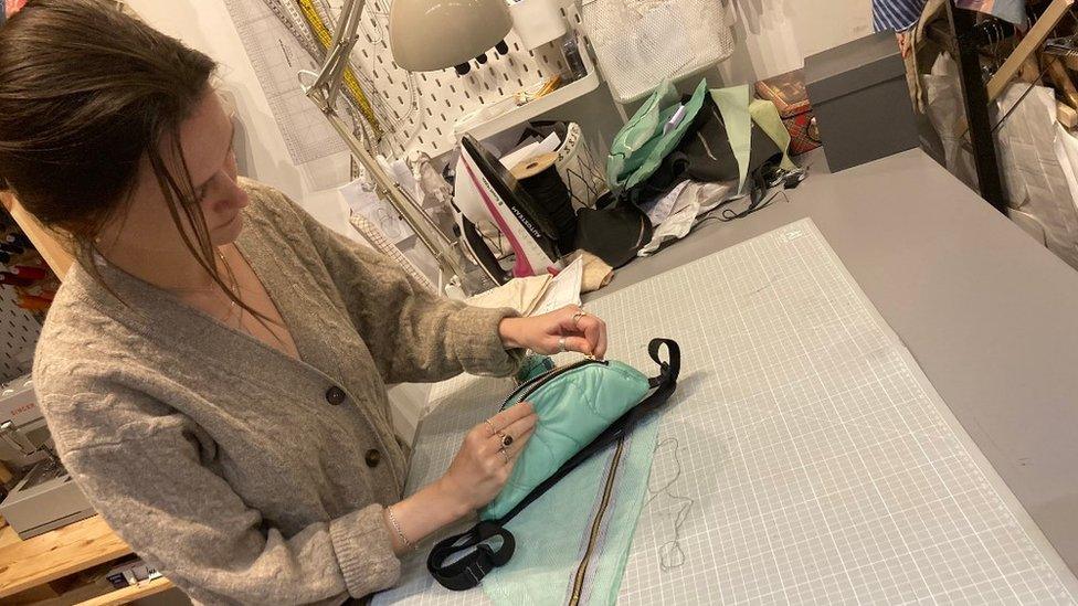 Josefin Wanner making a bag out of a tent