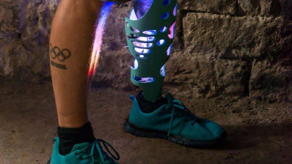 A prosthetic leg which is lit up with an LED light