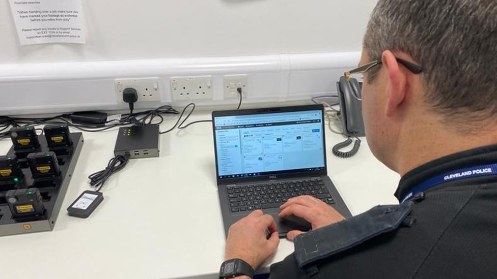 A police officer using Nice's evidence-gathering software