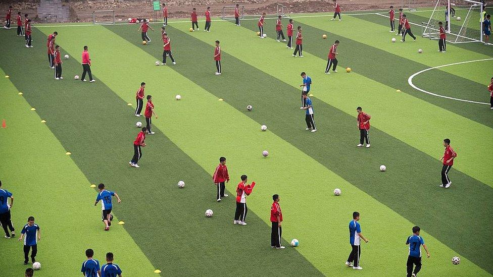 Students taking part in a football practice at the Tagou martial arts school in Dengfeng, China