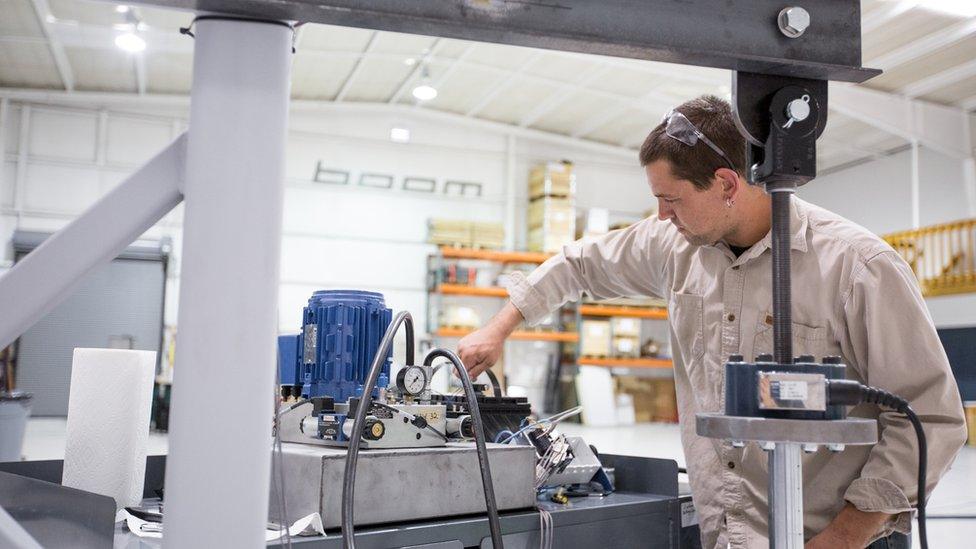 worker carrying out a wing-spar test