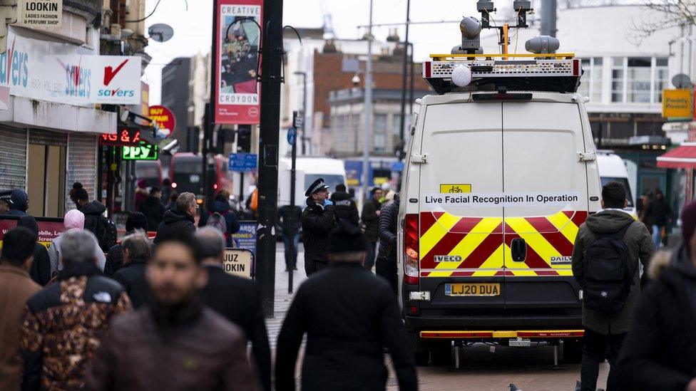 Van with cameras and a sign stating live facial recognition in operation