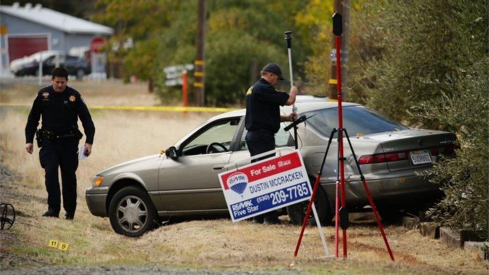 Police examine a vehicle that was involved in the string of shootings in Rancho Tehama