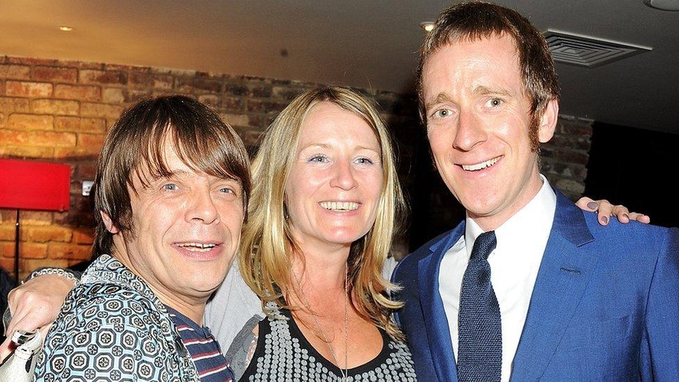 Mani from the Stone Roses with his wife Imelda Mounfield and cyclist Bradley Wiggins, all smiling