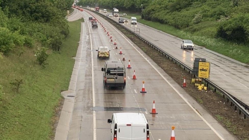 Traffic on A11 northbound, with traffic cones barricading the right-hand lane