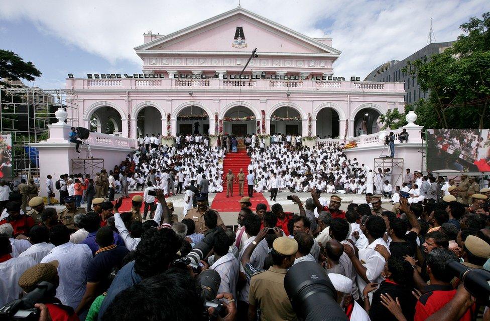 Supporters gather outside Rajaji hall for the funeral of M Karunanidhi in Chennai on 8 August 2018.