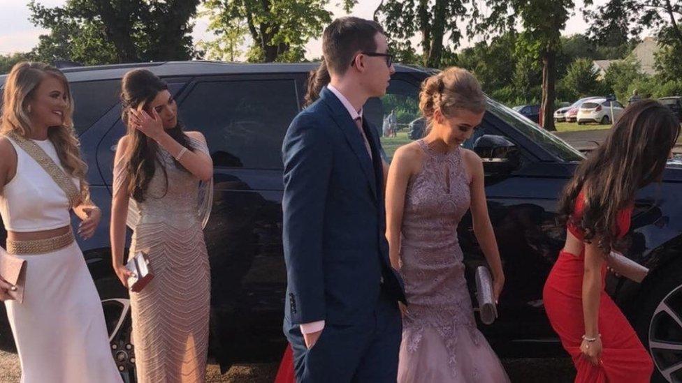 The group enter their prom