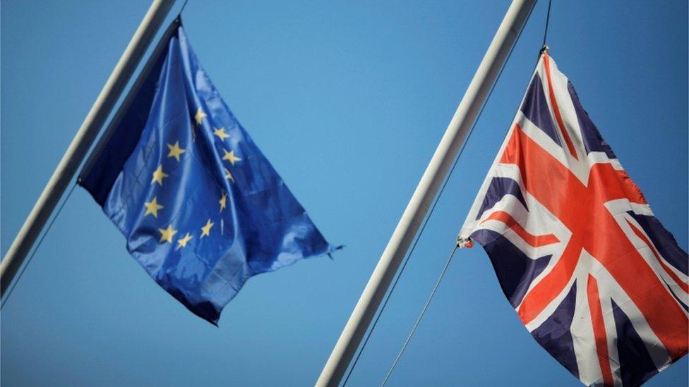 EU flag and Union Jack flying side by side