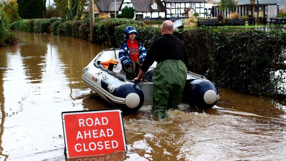 Jack, aged 7, is rescued as the village of Severn Stoke is cut off amid flooding after heavy rain from Storm Henk