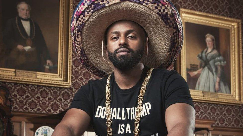 Magid Magid in 'Donald Trump is a wasteman' T-shirt