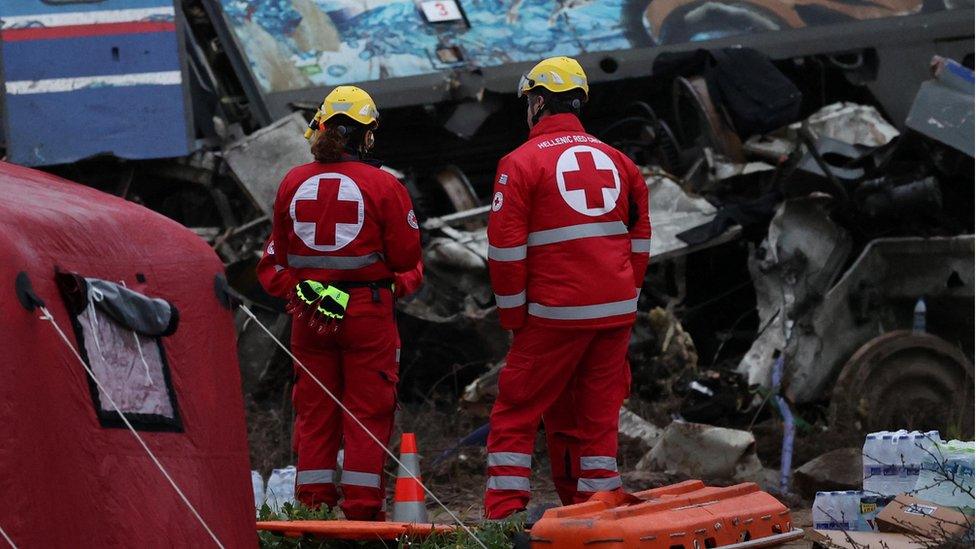 Rescuers operate on the site of the crash