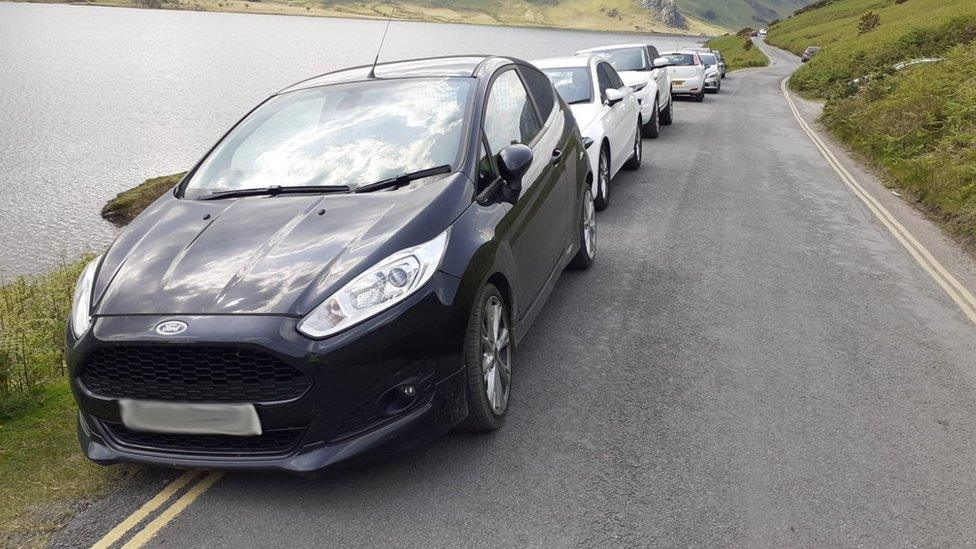 Cars parked on double yellow line