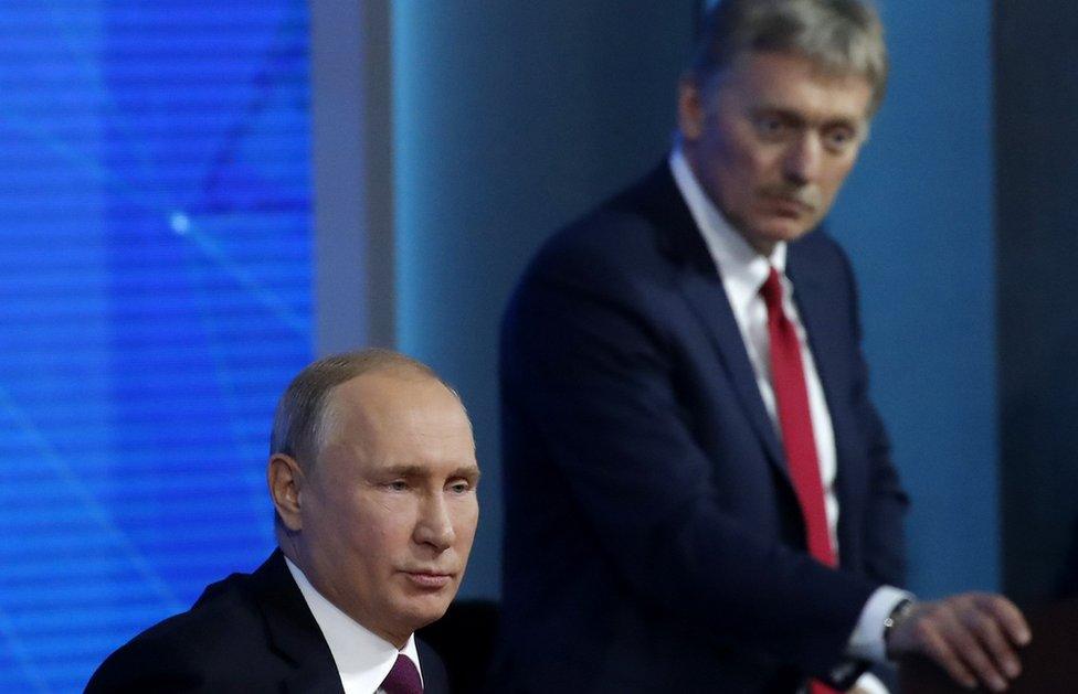 Kremlin spokesman Dmitry Peskov listens as Russian President Vladimir Putin speaks during annual news conference in Moscow, Russia December 20, 2018