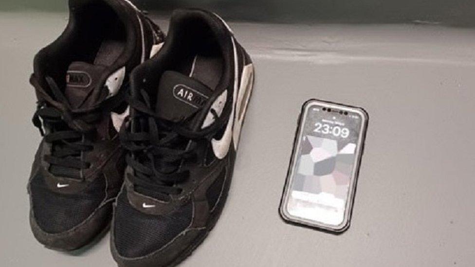 The victim's phone and trainers