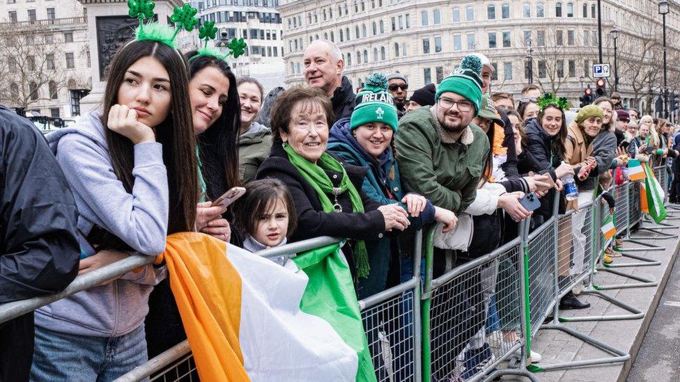 Onlookers wait for the parades at 2023's edition