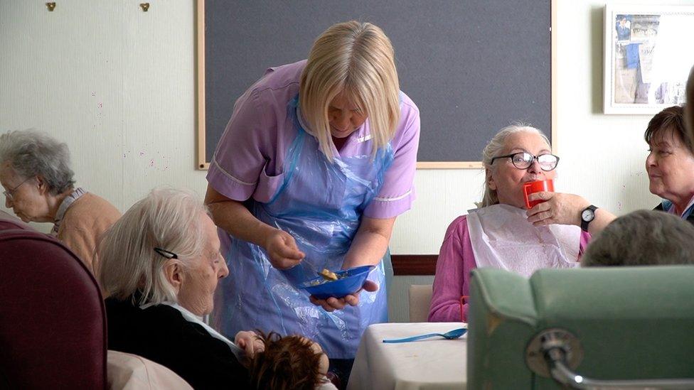 Care worker with residents, St Brelade's, Kent