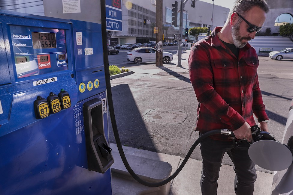 Man filling tank in California