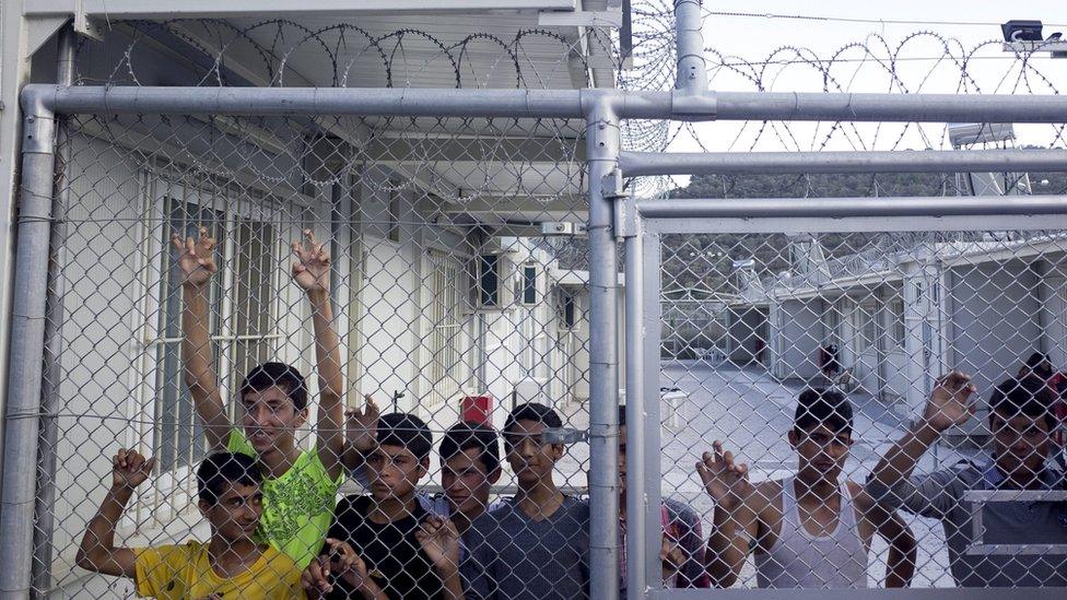 Afghan refugees are seen inside a refugee camp during the visit of Greek Prime Minister Alexis Tsipras and Austrian Chancellor Werner Faymann (both not pictured) near the city of Mytilene on the island of Lesbos, Greece, 6 October 2015