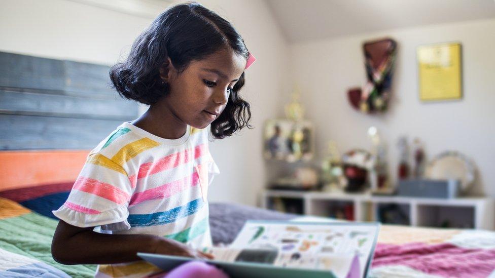 girl-reading-at-home