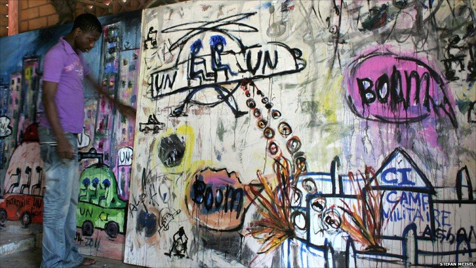 Abdoulaye Diarrasouba by one of his paintings