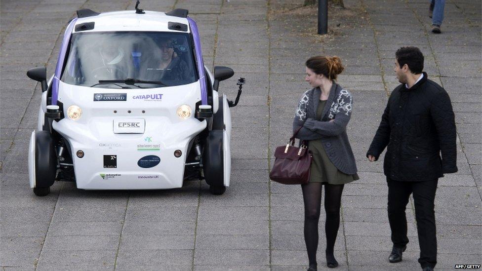 An autonomous self-driving vehicle, as it is tested in a pedestrianised zone