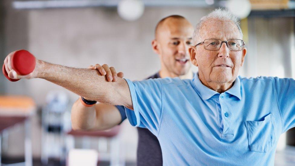 An elderly person exercising