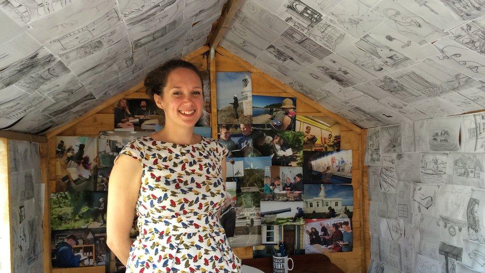 Elizabeth in one of the sheds decorated with the sketches