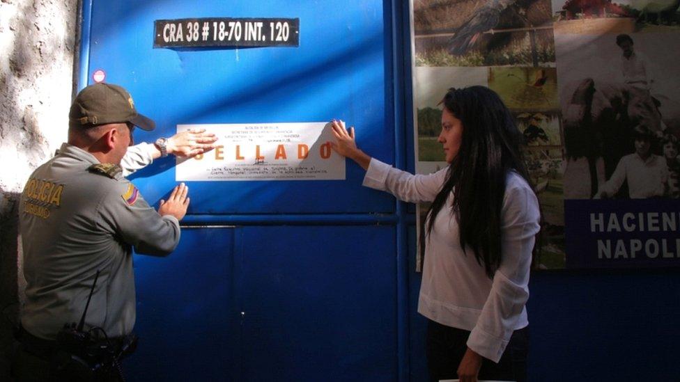 Police close a house owned by the brother of late Colombian drug lord Pablo Escobar, the site of a museum dedicated to the cocaine lord in Medellin, Colombia, on 19 September 2018