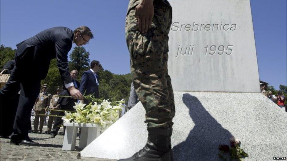 Prime Minister Aleksandar Vucic lays flowers during a ceremony marking the 20th anniversary of the Srebrenica massacre in Potocari