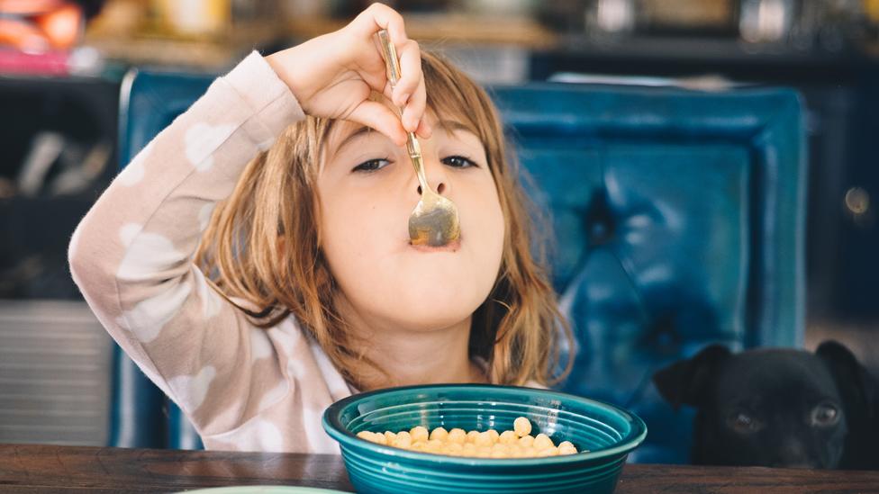 A girl eating cereal