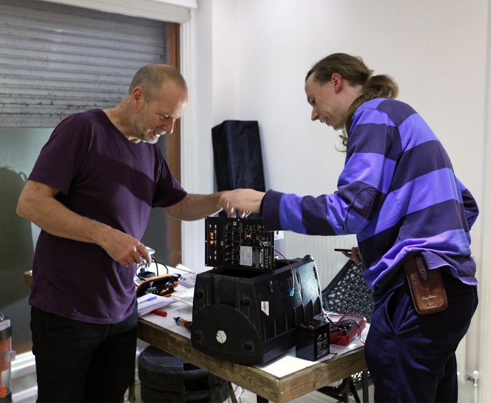 Dermot and Harry repair a portable speaker at the Fixing Factory in Camden, London