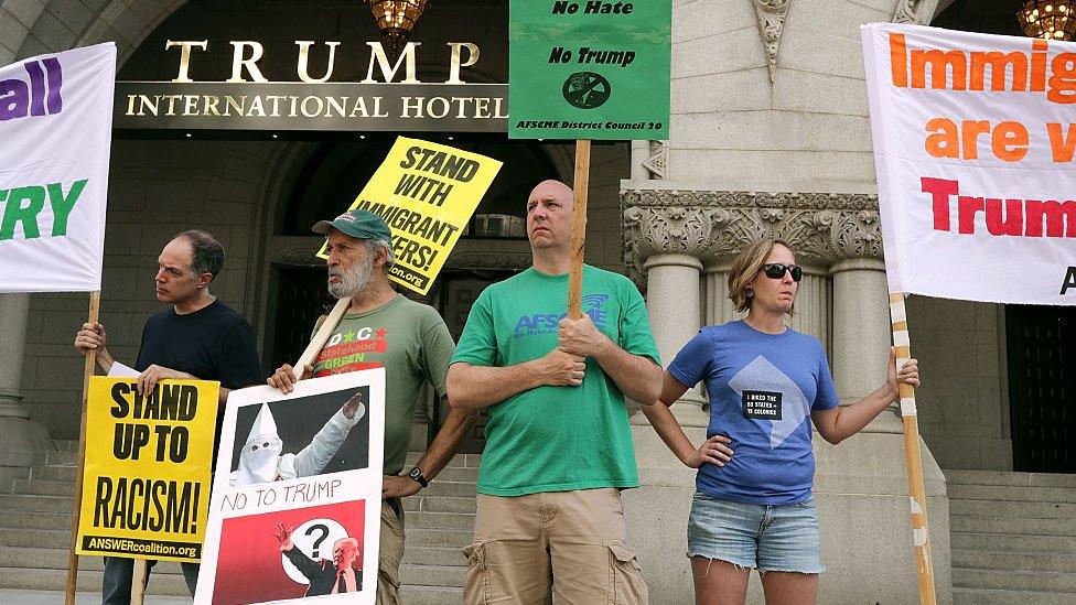 Protestors gather outside Donald Trump's Washington, DC, hotel.