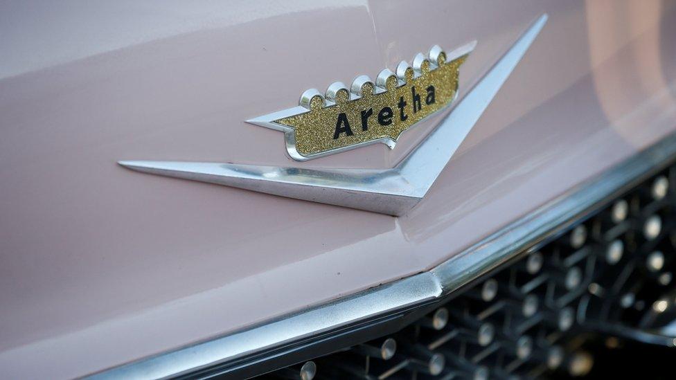 A Cadillac with Aretha's name emblazoned on the front