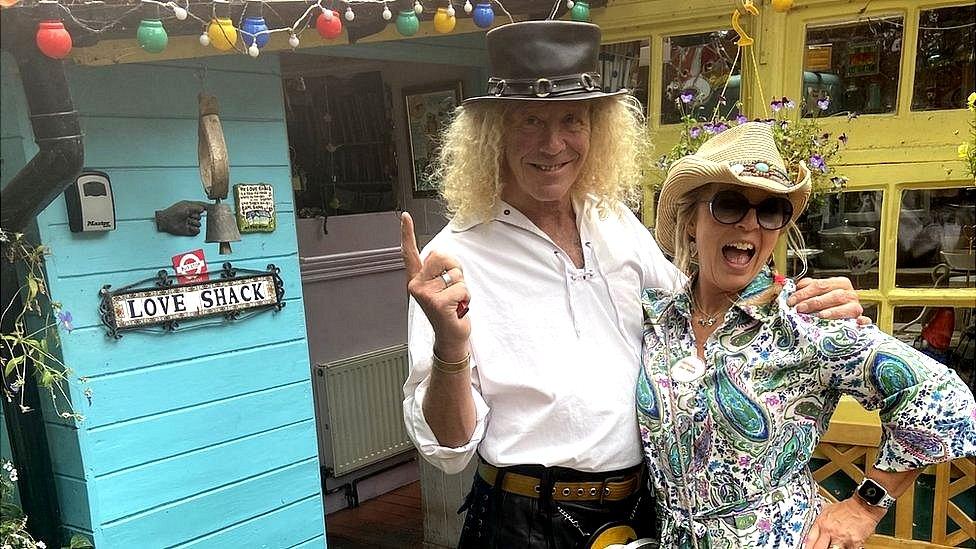 Steve Cassini and his wife Sheba outside their home on Eel Pie Island