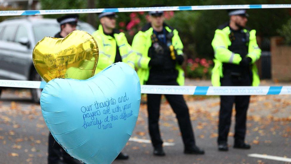 Police officers staff a cordon left at the scene of the fatal stabbing of British lawmaker David Amess,