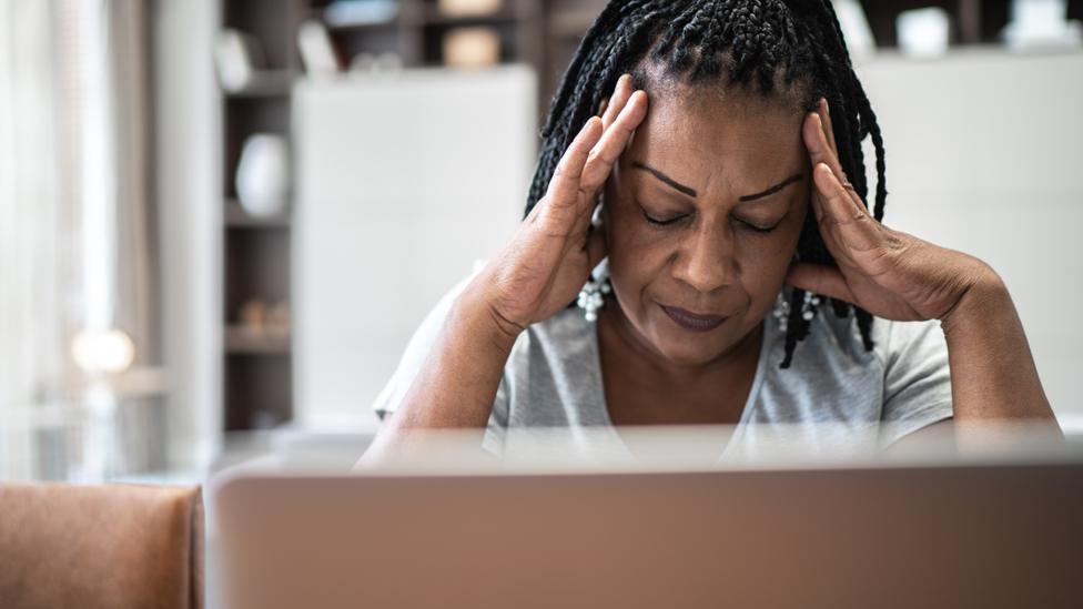 Woman sitting at a laptop