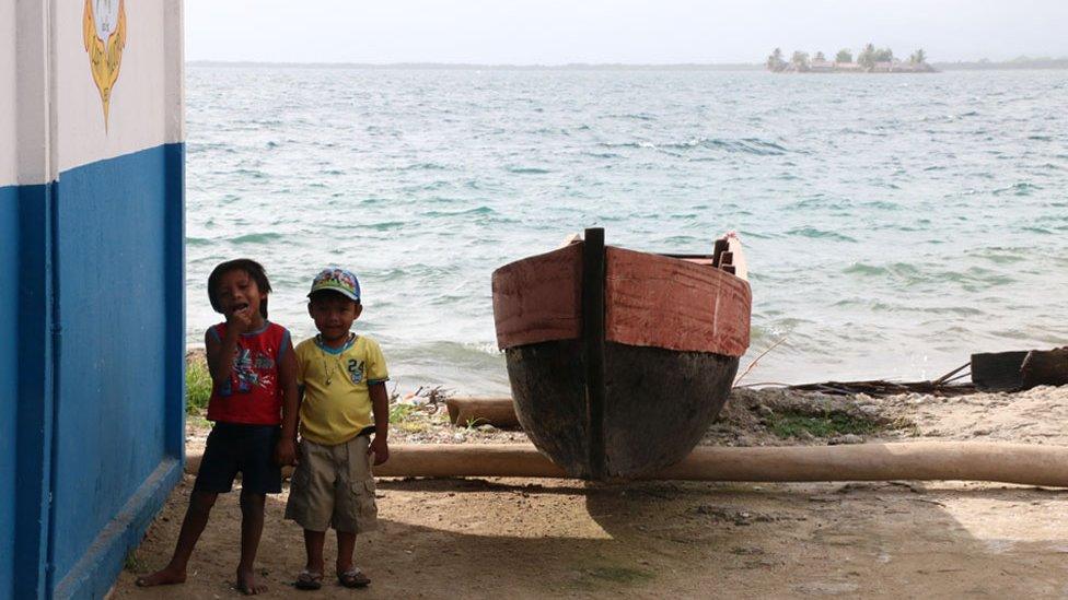 Children and a canoe