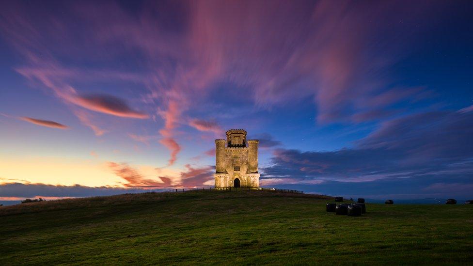 A spectacular sunset behind Paxton's Tower in Carmarthenshire