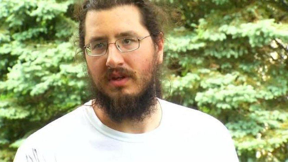 Michael Rotondo speaks to reporters before leaving his parents' home in Camillus, New York