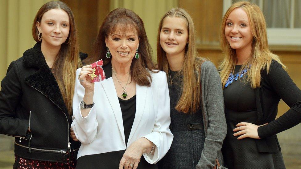 Jackie Collins with her granddaughters, receiving an OBE at Buckingham Palace in 2013