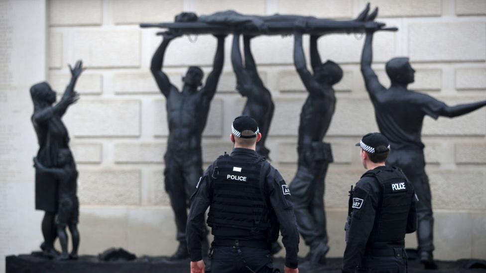 Police looking at a memorial