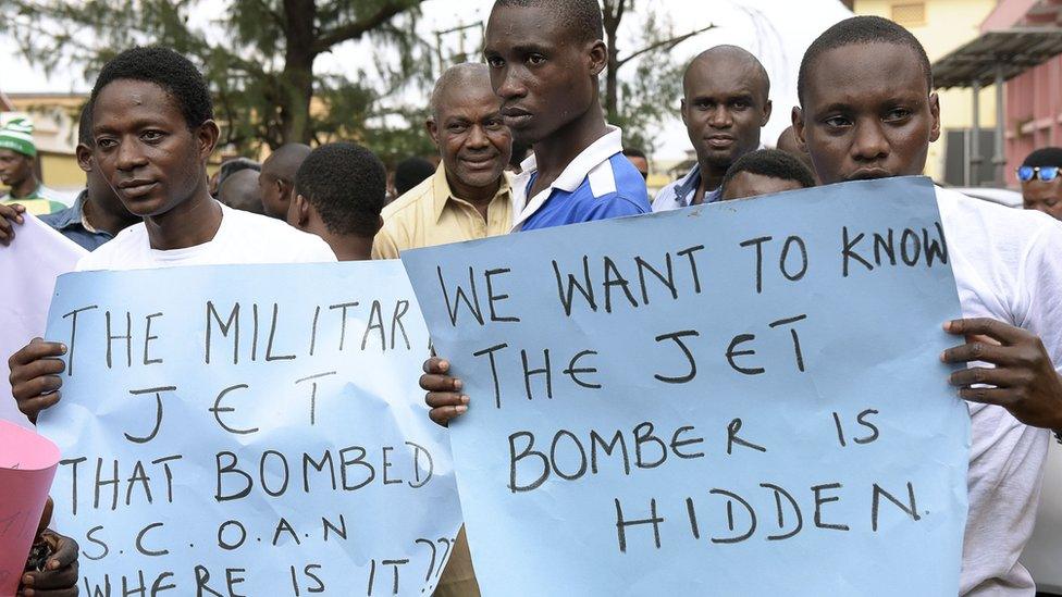 TB Joshua followers holding placards