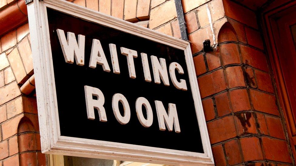 A waiting room sign