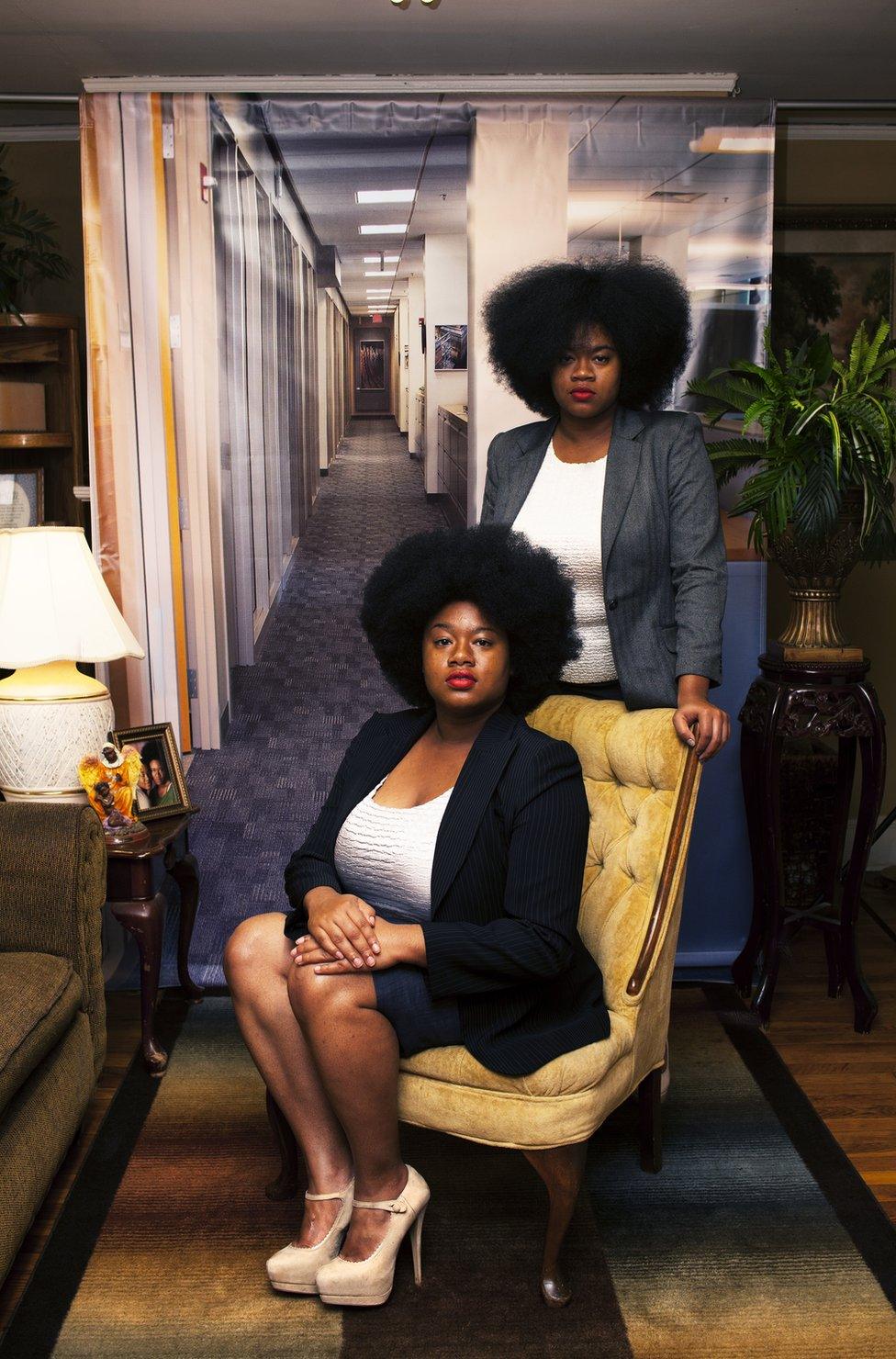 Portrait by Endia Beal showing two women dressed for the corporate workplace