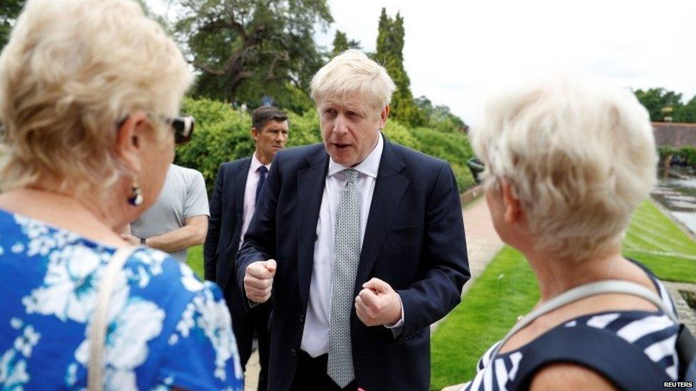 Boris Johnson speaks to members of the public on a visit to the Royal Horticultural Society as Wisley