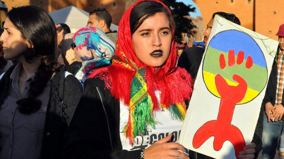 A woman holding up an Amazigh sign during a protest in Al-Hoceima, Morocco - Sunday 6 November 2016